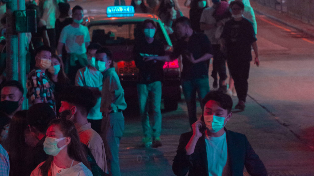 crowd wearing face masks in asian streets 