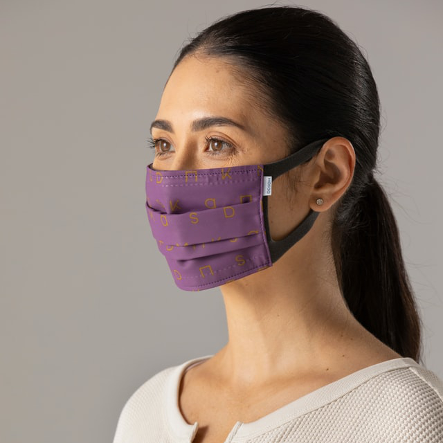 woman wearing purple face mask