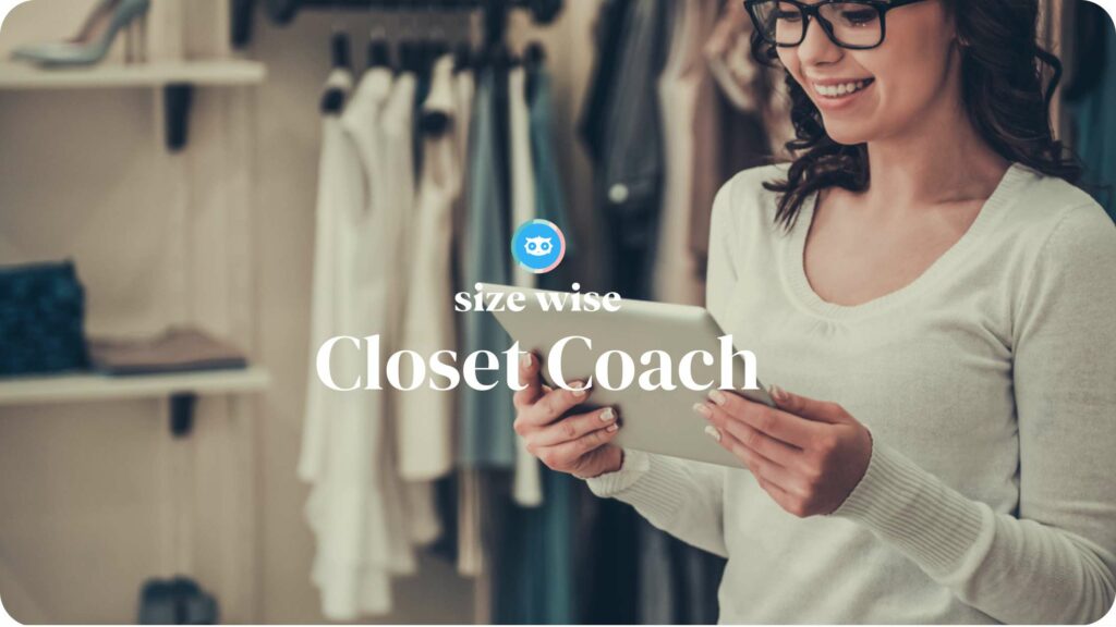 A woman holding a tablet with the words closet coach and stylists.