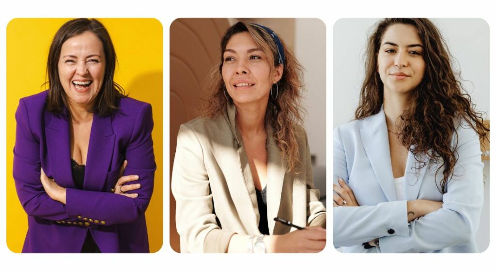Four women in business posing for a photo, discussing what's in your closet.